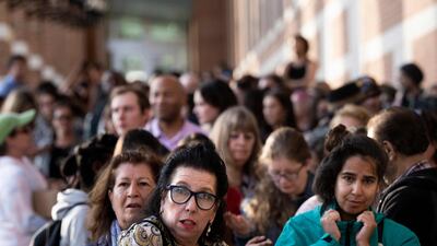 The line for access to the courtroom stretches around the building. AFP
