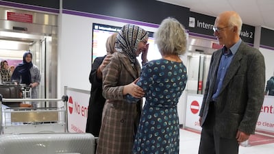 John and Lorna Norgrove, parents of aid worker Linda Norgrove, greet the group of women from Afghanistan
