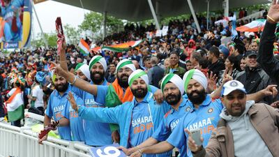 Even as it dawned on the thousands of India fans at the game that there was going to start late, they decided to get the party started anyway. Several of them sung to liven the proceedings. Andrew Yates / AFP