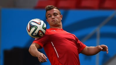 Switzerland midfielder Xherdan Shaqiri controls the ball during a training session in Brasilia on June 14, 2014, ahead of their Group E match against Ecuador on June 15 in the 2014 Fifa World Cup. Anne-Christine Poujoulat / AFP