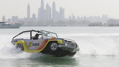One of the amphibious cars at Palm Jumeirah on Tuesday, as part of the Dubai Motor Festival. Sarah Dea / The National