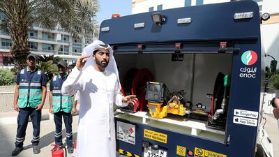 Saeed Amir, chief business officer of ENOC Link demonstrates the equipment on one of the company's 30 initial ENOC link delivery lorries. Pawan Singh / The National.