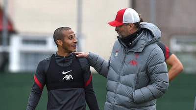 Jurgen Klopp, manager of Liverpool, with Thiago Alcantara. Getty