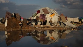 Palestinians living in a tent in a makeshift camp on Gaza city's beach in the middle of winter. AP Photo