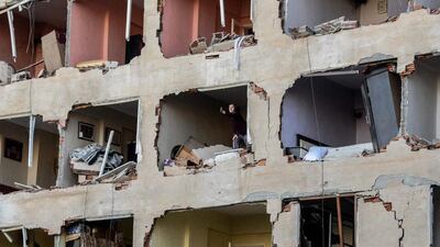 A woman stands in her damaged apartment on November 4, 2016, after a strong blast in the southeastern Turkish city of Diyarbakir. At least one person was killed and 30 injured by the blast outside a police building in the city, which is the centre of the Kurdish minority, medical sources told AFP. The explosion occurred just hours after police detained the two co-leaders of the country’s main pro-Kurdish party and several other MPs in a major escalation of a broader crackdown against leading Kurds. Ilyas Akengin / Agence France-Presse