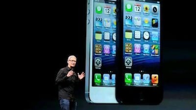 Tim Cook, the chief executive of Apple, unveils the iPhone 5 in San Francisco, California. David Paul Morris / Bloomberg News, NPD Group, Gartner