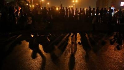 Supporters of the deposed Egyptian president Mohammed Morsi confront soldiers on a highway to the airport in Cairo. Hussein Malla / AP Photo