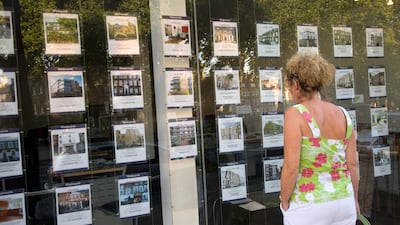 Houses for sale in an estate agent's window, London. The OECD ranks Britain number one in property taxes as a share of GDP. Photo: Alex Segre