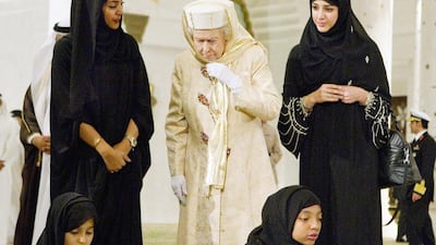 From left: Fatima al Melhi, cultural guide, Queen Elizabeth II, and Reem al Hashemy, Minister of State during her visit at the Sheikh Zayed Grand Mosque at the start of her second state visit to the UAE on November 24, 2010. Philip Cheung / EPA