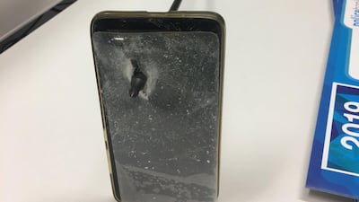 A picture shows an arrow that pierced a smartphone after an incident in Nimbin, Australia. NSW Police via Reuters