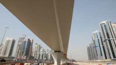 Dubai Metro's elevated track on Sheikh Zayed Road. Dubai Marina Residence is on the left, and Jumeirah Lakes Towers are on the right.