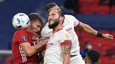 Benjamin Pavard, left, of Bayern Munich against Nemanja Gudelj of Sevilla. EPA