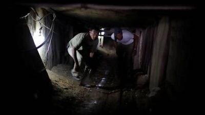 Palestinians inside a smuggling tunnel beneath the Gaza-Egypt border in the southern Gaza Strip.