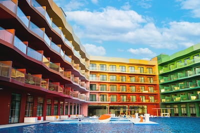 The Cote d’Azur Monaco Hotel looms over a large swimming pool, complete with submerged loungers. Photo: Cote d’Azur Monaco Hotel / Heart of Europe