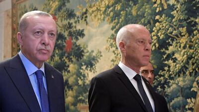 Turkish President Tayyip Erdogan, left, has critisised the dissolving of Tunisia's parliament by Tunisia's President Kais Saied, right. AFP
