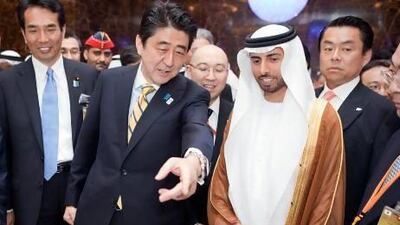 Shinzo Abe, centre left, with Minister of Energy Suhail Al Mazrouei before the Japan-UAE Business Forum. Silvia Razgova / The National