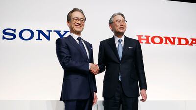 Sony Group chief executive Kenichiro Yoshida and Honda Motor chief executive Toshihiro Mibe announce the partnership to develop electric vehicles, in Tokyo. AP