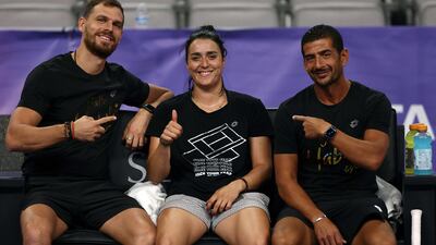 FORT WORTH, TEXAS - OCTOBER 28: (L-R) Karim Kamoun, Ons Jabeur of Tunisia and coach Issam Jellali take a break during practice on center court prior to the 2022 WTA Finals, part of the Hologic WTA Tour, at Dickies Arena on October 29, 2022 in Fort Worth, Texas. Tom Pennington / Getty Images / AFP