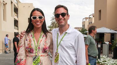 Emi Suzuki and Eric Tanner on championship race day behind the Pit Lane Walk at the Yas Marina Circuit in Abu Dhabi. Victor Besa / The National