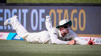England's Joe Denly slides to save a boundary. AFP
