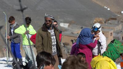A local walks amongst the participants as they prepare to get ready. Rick Findler for The National