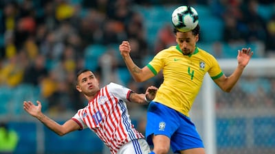 Paraguay's Derlis Gonzalez, left, and Brazil's Marquinhos go for the ball. AFP