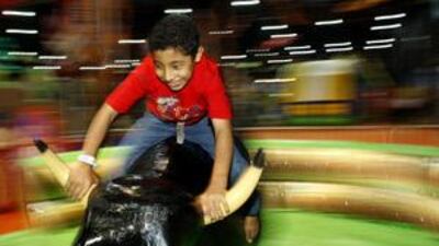 Mohammed Ramadan, 11, rides a mechanical bull at last year's Summer in Abu Dhabi at Adnec.