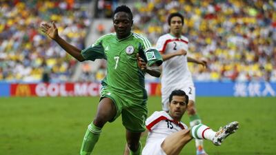 Ahmed Musa, left, and Nigeria face a potential Fifa ban that would derail the defence of their title. Ivan Alvarado / Reuters