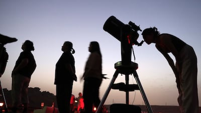 Stargazers view the Perseid meteor shower from a camp near the Mleiha Archaeological Centre in Sharjah in August 2024. Pawan Singh / The National