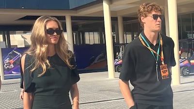 Italian tennis star Jannik Sinner with Danish model Laila Hasanovic at the track on Sunday. Saeed Saeed / The National