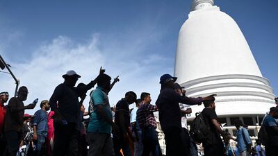 Demonstrators take part in a procession against Mr Wickremesinghe. AFP