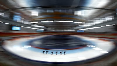 In this picture made with a fisheye lens, South Korean speedskaters train on Feb. 20, 2014. Patrick Semansky / AP Photo