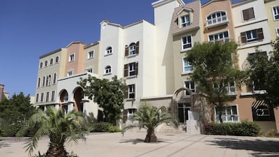 Notices were issued to occupants of 65 flats in a Discovery Gardens building last week to pay their dues. Sarah Dea / The National