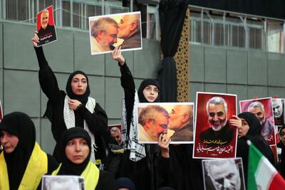 Hezbollah supporters hold pictures of their leader Hassan Nasrallah with Qassem Suleimani, the Iranian general killed by the US, at a rally in Beirut January 5, 2020. Bloomberg