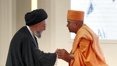 Swami Brahmavihari greets Ali Al Amin at the Global Conference of Human Fraternity in Abu Dhabi. Chris Whiteoak / The National
