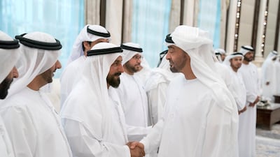 Sheikh Mohammed bin Zayed, Crown Prince of Abu Dhabi and Deputy Supreme Commander of the UAE Armed Forces (R) greets Muftah Ali Al Khateri (2nd R), during an iftar reception at Al Bateen Palace. Hamad Al Kaabi / Crown Prince Court - Abu Dhabi