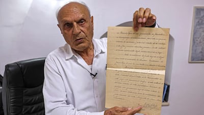 Khader with a letter written by Rawhi Al Khalidi, who was a consul for the Ottoman empire