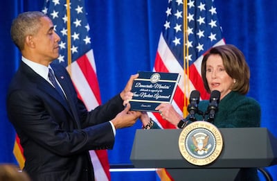 In this January 28, 2016 file photo, Barack Obama, left, is presented a copy of the Iran Nuclear Agreement Legislation by House Minority Leader Nancy Pelosi. AP Photo
