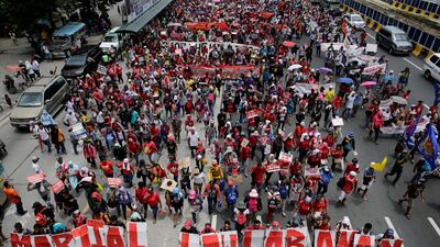 Activists march toward the Philippine Congress building to protest prior to Philippines president Rodrigo Duterte's State of the Nation Address. EPA