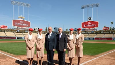 Emirates cabin crew stand by president Tim Clark (left) and Dodgers president Stan Kasten. Courtesy Emirates