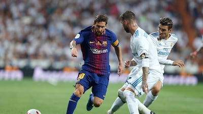 Lionel Messi's Barcelona, left, will be in action this weekend. Francisco Seco / AP Photo