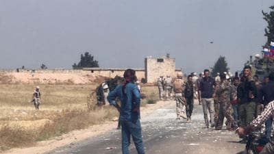 Russian soldiers near the site of an apparent roadside attack in Aleppo, Syria, for which the cause remains unknown. Reuters