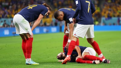 Lucas Hernandez of France is attended to by teammates after being injured. Getty