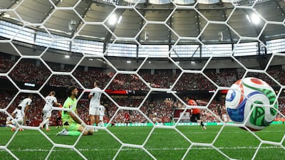 New Zealand's Max Crocombe looks dejected after Egypt's Mohamed Salah scores their second goal. Reuters
