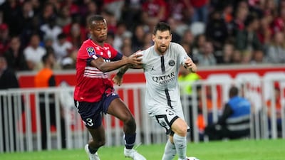 Tiago Djalo of Lille competes for the ball with Lionel Messi of PSG. Getty Images