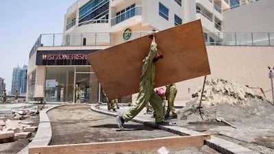 Workers from the Better Gardens landscaping company were still at work at 12:50pm on a project in the Marina yesterday; the company blamed first-day confusion.
