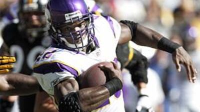 The Vikings' Adrian Peterson eludes the Steelers' Lawrence Timmons in NFL action on Sunday.
