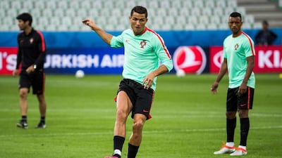 Portugal’s forward Cristiano Ronaldo makes a shot at goal during a Euro 2016 training session at the Geoffroy-Guichard stadium in St Etienne on June 13, 2016 on the eve of their opening match against Portugal. Odd Andersen / AFP