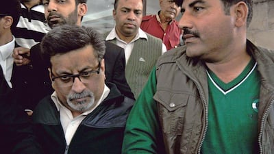 Rajesh Talwar, left, was found guilty of murder by the court in Ghaziabad. AFP Photo