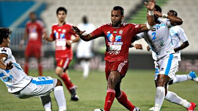 Jazira's Luiz Fernando Da Silva keeps the ball from Baniyas players Fahad Sabil Obeid ¨ and Mohamed Jaber. Jeff Topping/The National